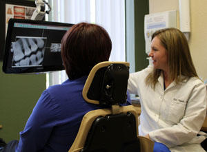 Dr. Kasi Franck of Franck Family Dentistry in Rocklin, California - reviewing x-rays with a patient